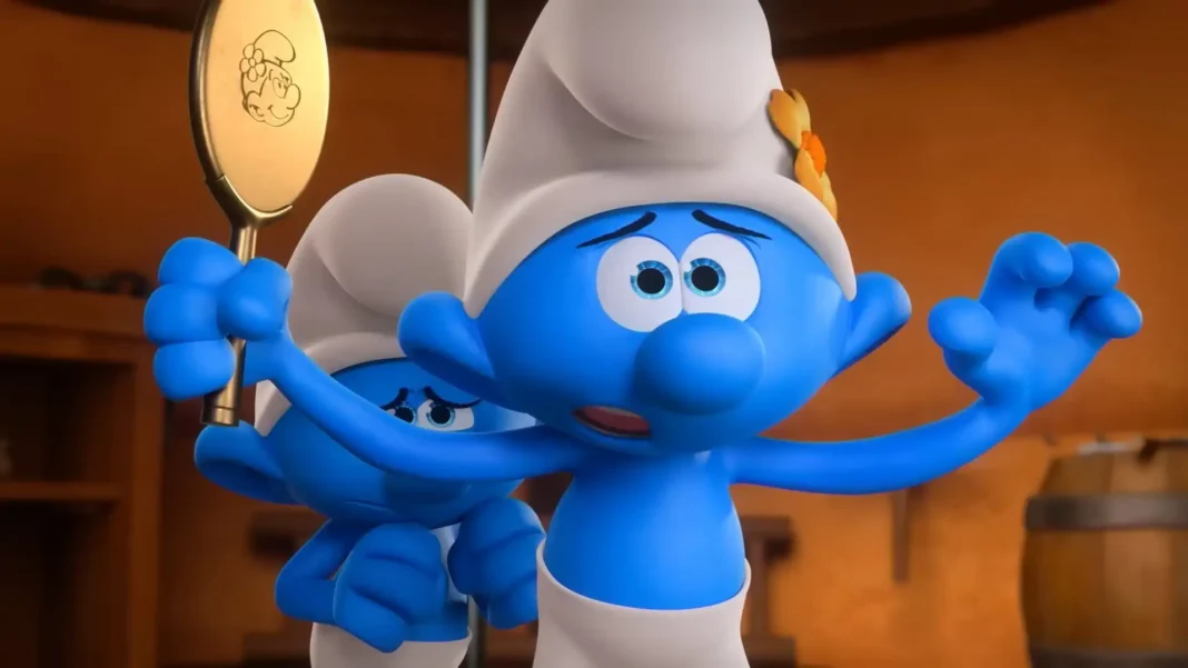 Dois Smurfs parecem assustados. O da frente, com uma flor no chapéu, está com os olhos arregalados e as mãos levantadas. O Smurf atrás dele segura um espelho oval dourado.