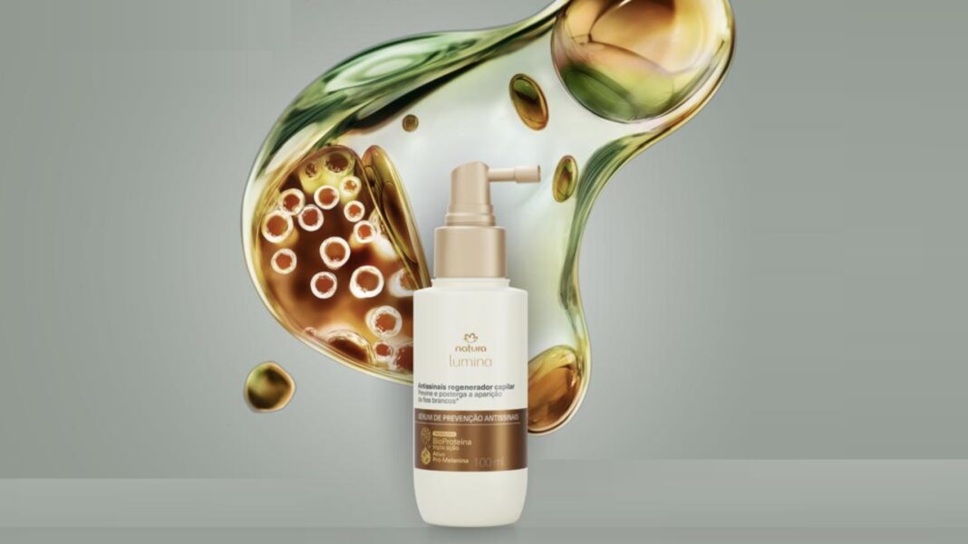Mostrou seu primeiro fio branco Natura tem presente especial para você Produto Natura Lumina Soro de Prevenção Antipoluição em destaque com um líquido dourado e verde flutuante atrás.
